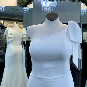 Crepe fit and flair one shoulder wedding gown